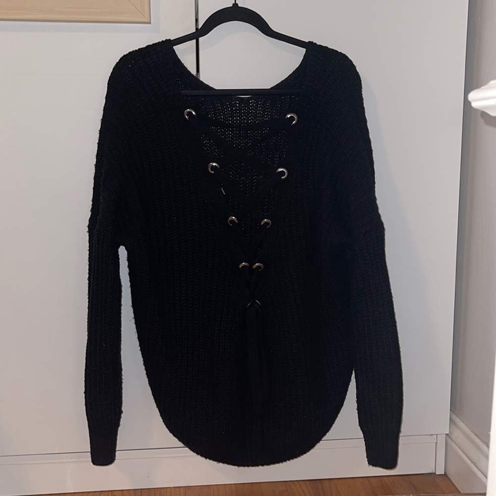 Black sweater, open tie back, main strip, size M